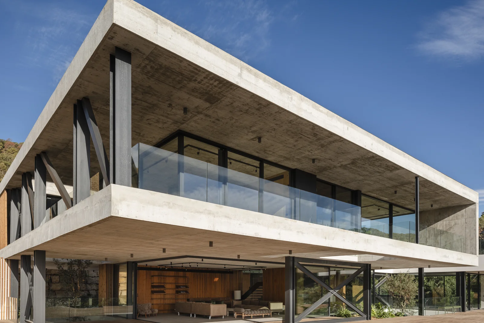 Contemporary exposed-concrete villa with large cantilevers and glazed terraces