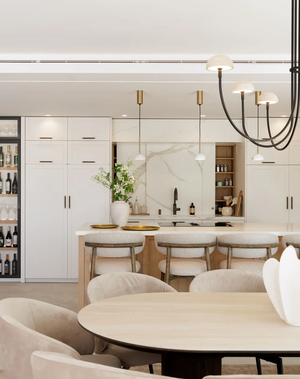 Cocina abierta con isla, vinoteca y comedor en una villa terminada