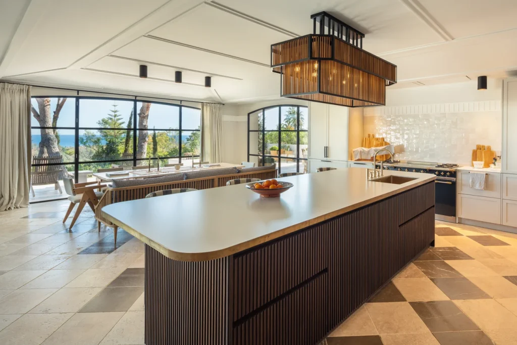 Kitchen with a central island and dining area at Villa Gratitude