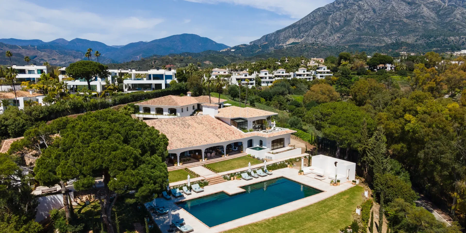 Aerial view of Villa Gratitude on Marbella's Golden Mile, with its pool, pine woods and La Concha in the background