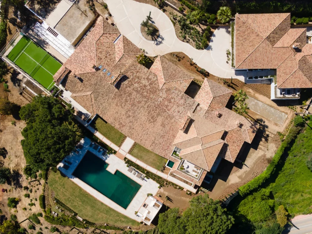 Overhead view of Villa Gratitude with its tiled roof, pool and garden