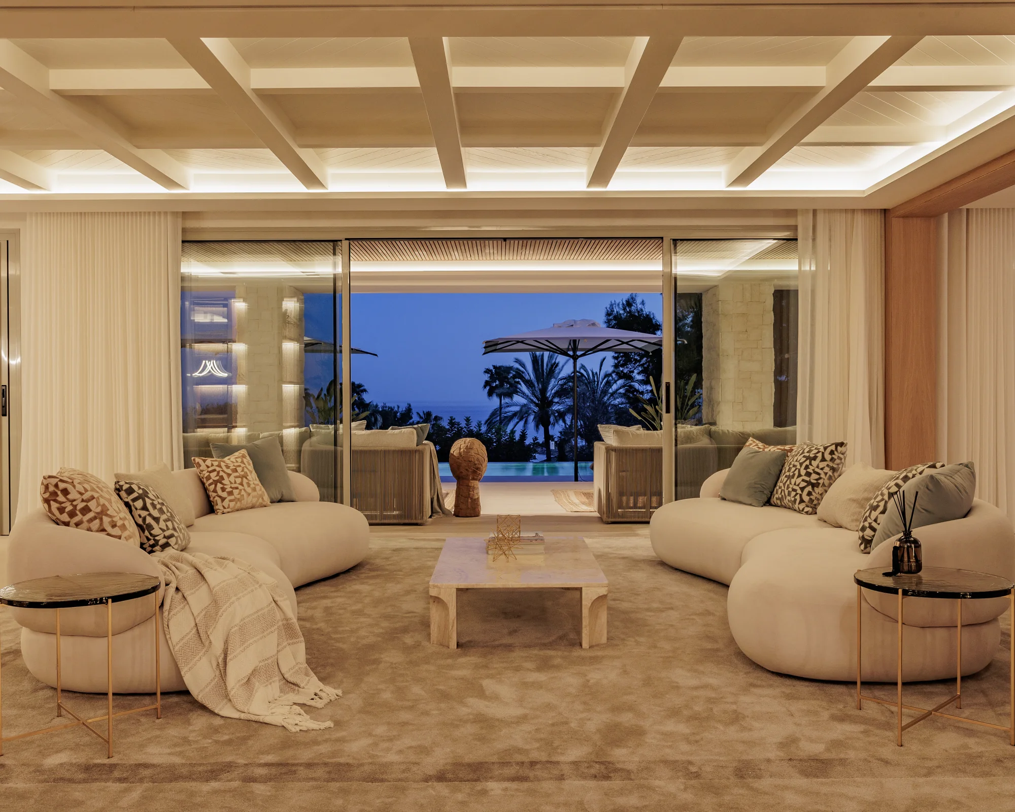 Renovated living room with open coffered ceiling, looking onto the garden and views, Villa Altos Reales in Marbella