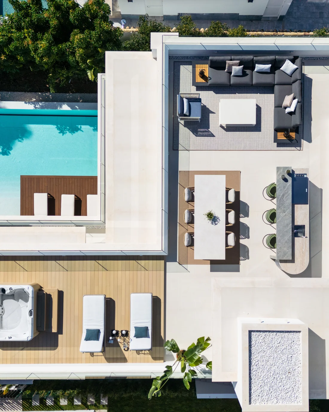 Aerial view of a contemporary villa with pool, hot tub and terraces