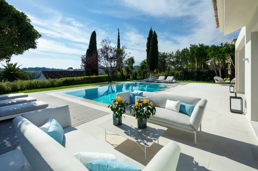 Outdoor lounge beside the pool at Villa Begoña